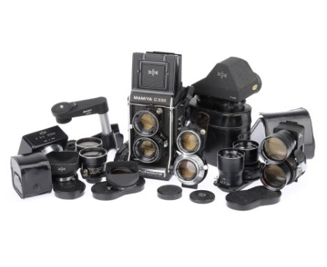 A Mamiya C330 Professional F Medium Format TLR Camera Outfit, with 5 lenses, camera body black, body G-VG, bellows appear goo