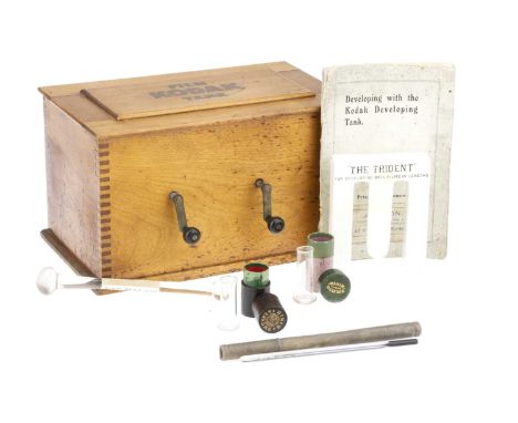 A Kodak Film Tank, together with a glass pestle, a 'Trident' film developing accessory, &amp; two very small graduated cylind