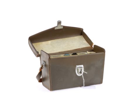 A Leitz Wetzlar Leather Camera Outfit Case, for Leica cameras, in G conditions, signs of light repair & use present, with two