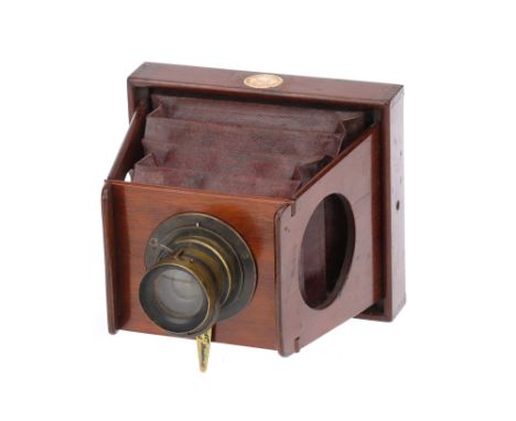 A Shew &amp; Co Patent Eclipse 4 x 5" Mahogany Strut Folding Camera 1890s, maroon red bellows, Shew Darlot Paris brass lens w