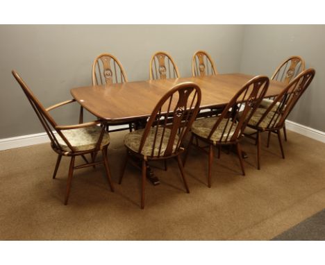 Ercol golden dawn finish elm dining table with three additional leaves (101cm x 162cm - 255cm (with leaves)), and eight stick