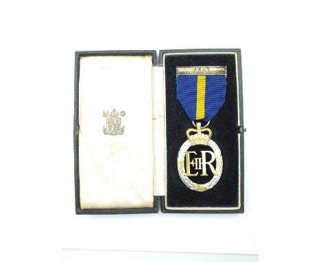 An EIIR boxed Army Emergency Reserve Medal, the crowned white and yellow metal laurel wreath with centered EIIR cypher, engra