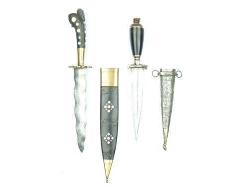 Two Horn Mounted Eastern Daggers, the first with 18cm wavy blade, carved horn hilt set with mother-o'-pearl discs, contained 