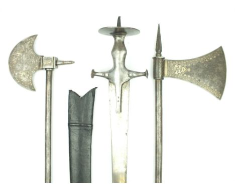 Two Late 19th Century Indian Axes and a Tulwar, the first axe 71cm over all length, 12cm diameter head decorated with scrolli