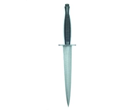 A Nato Third Pattern Issued Commando Knife, 18cm flattened diamond section blade, the blackened hilt with blackened crossguar