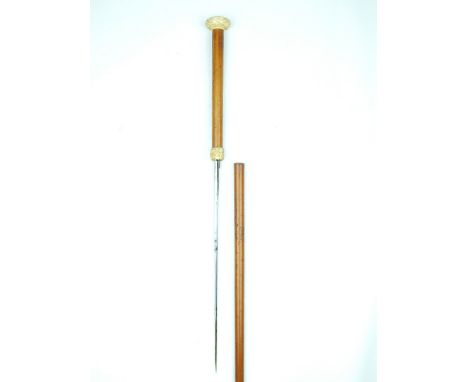 A 19th Century Ivory Mounted Malacca Swordstick, 33cm flattened diamond section blade, the malacca handle with basket weave c