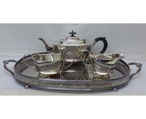 A silver plated gallery tray and a three piece silver plated tea service