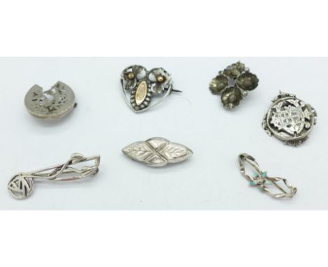Seven silver and white metal brooches including one by Charles Horner with a/f enamel