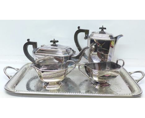 A four piece silver plated tea service and a plated tray