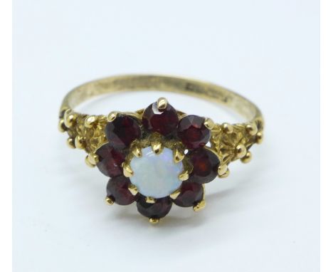 A 9ct gold, garnet and opal cluster, 1.7g, L