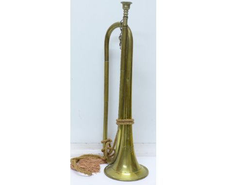 A brass bugle marked A.F. Matthews (Drs) Ltd. makers, London, 1946