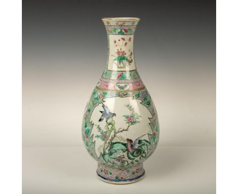 A beautiful green and pink enamel vase featuring a bird perched on a blossomed tree on one side, and an eagle staring down a 