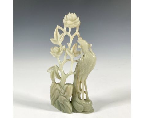 A light green carved jade figure of a bird, possibly peacock, amongst flowers and foliage. Issued: 20th c.Dimensions: 1.25"L 