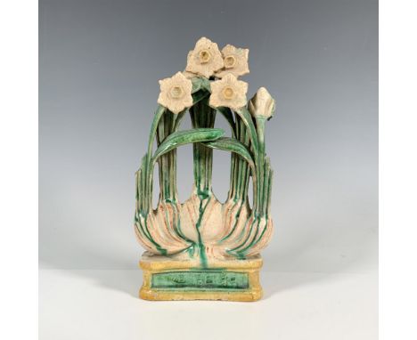 A floral figure with flour bloomed daffodils on a ceramic base with Chinese characters. Dimensions: 4.5"L x 1.75"W x 8.5"HCou