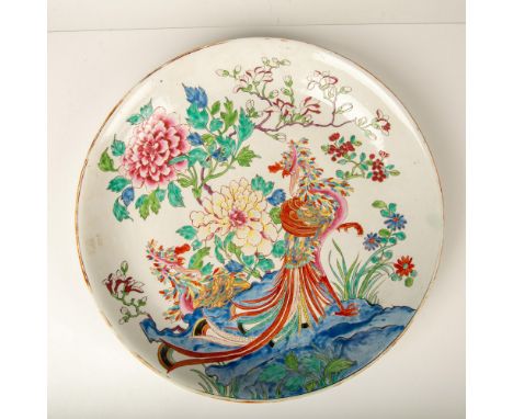 A large white bowl adorned with hand painted enamel vibrant colors that beautifully features two phoenixes under a blossomed 