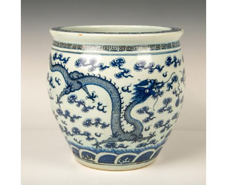 A beautiful large planter featuring in blue two dragons fighting over a pearl. Issued: 19th centuryDimensions: 13.5"W x 12"HC