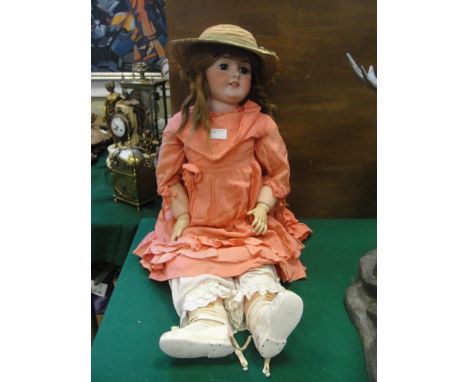 An early 20th century large bisque headed doll with impressed mark DEP 15 possibly French approx 34"