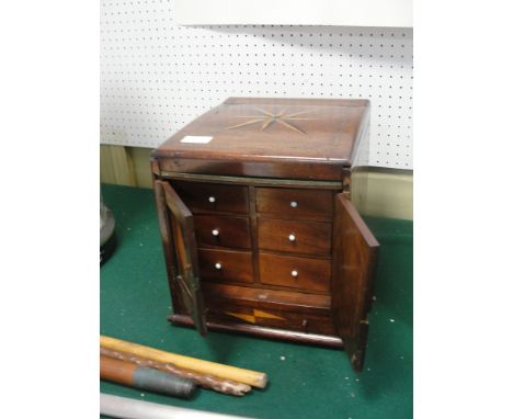 A Victorian mahogany inlaid cabinet made on board The Corton Light Vessel