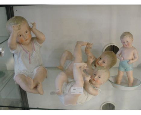 Four bisque piano babies, c1920 (A/F)