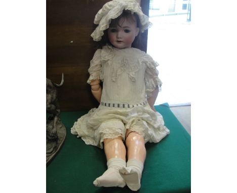 An early 20th century large bisque headed composite doll by Kammer & Reindhardt, the head marked with impressed marks for Sin
