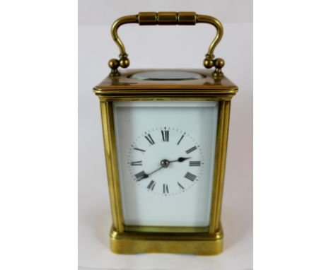 Brass striking carriage clock with bevelled glass panels, no key.