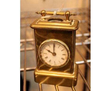 Miniature brass mechanical carriage clock