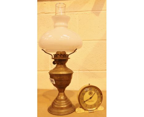 Vintage brass oil lamp and vintage Smiths alarm clock