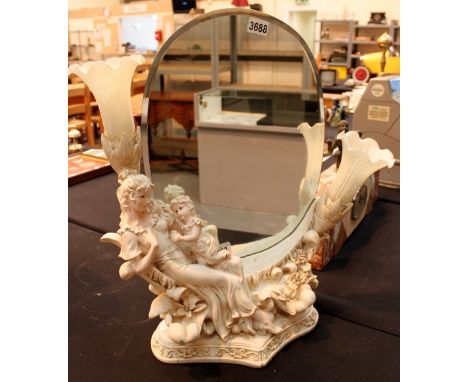 Large ceramic statuette mounted with oval mirror and pair of lights