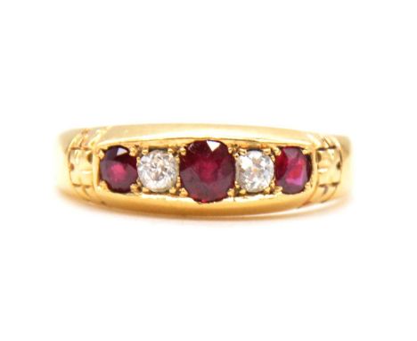 A ruby and diamond half hoop ring, two old cut diamonds and three rubies set in an 18 carat yellow gold mount ring size P, Ch