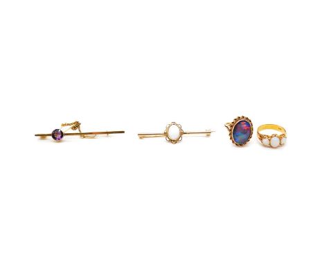 Amethyst and opal bar brooches, two opal rings, an oval cabochon cut opal mounted to the centre of a 45mm 9 carat yellow gold