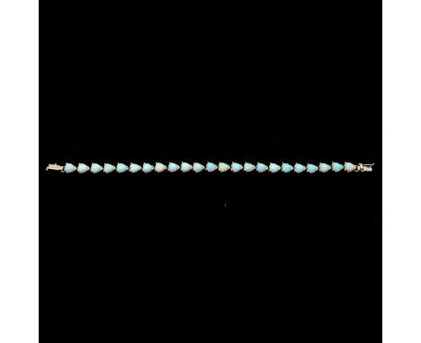 A synthetic opal bracelet, the twenty-three 6.8mm heart shaped cabochon cut stones individually claw set in a yellow metal br