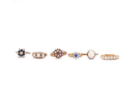 Six vintage 9 carat yellow gold gemset dress rings, set with opal, ruby, seed pearls, sapphire and synthetic blue and white s