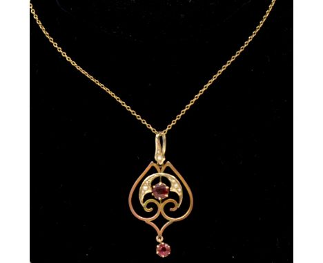 A garnet topped doublet and seed pearl pendant on trace link chain, the round brilliant cut garnet topped doublets claw set a
