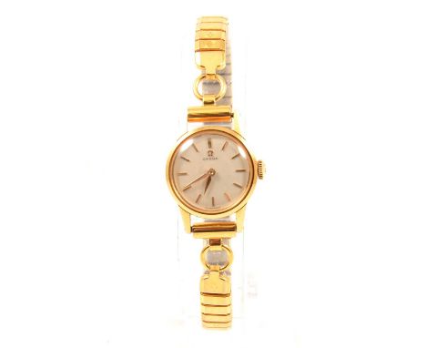 Omega - a lady's vintage yellow metal wristwatch, 16mm circular white baton dial in a 19mm circular yellow metal case, contin