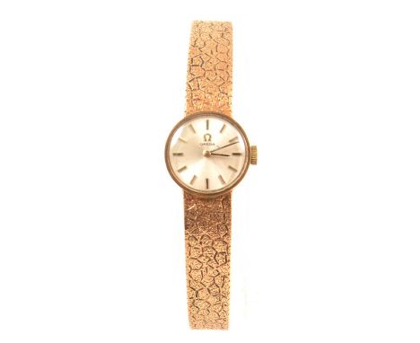 Omega - a lady's 9 carat yellow gold bracelet watch, 15mm circular champagne baton dial in a 9 carat yellow gold 17mm case, h