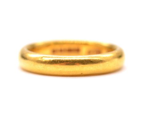 A 22 carat yellow gold wedding band, 4mm wide plain polished D-shape band ring size M, Birmingham 1927, 7.4g.