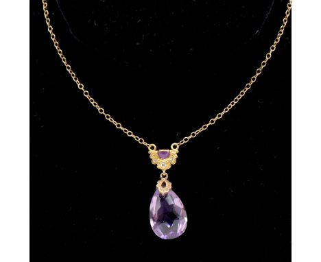 Am amethyst pendant and chain, the 20mm faceted pear shaped amethyst with a rose metal cap suspended from a yellow metal hoop
