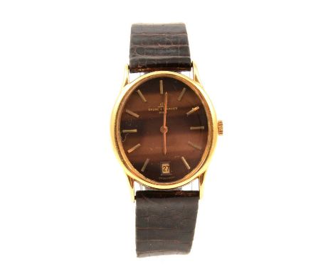 Baume &amp; Mercier- a Baumatic gentleman's 18 carat yellow gold wristwatch, the 29x24mm oval tiger's eye dial with baton hou