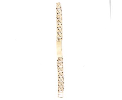 A 9 carat yellow gold bark textured identity bracelet, plain polished identity plate, 13.5mm wide flat curb links with a heav