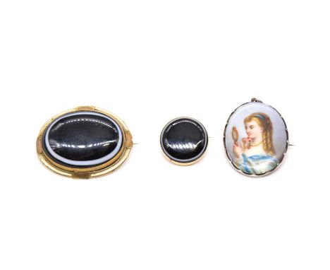 Two banded agate brooches and a portrait brooch, a circular banded agate memorial brooch, collet set in unmarked yellow metal