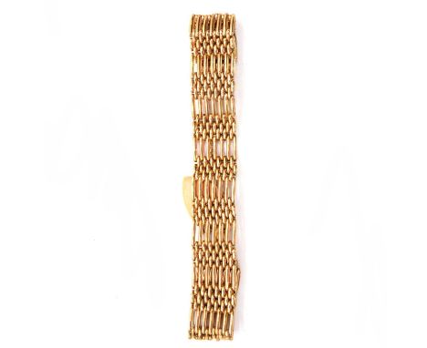 A modern 9 carat yellow gold seven bar gate link bracelet 15mm wide, fitted with a padlock fastener, Birmingham 1989, 27.6g.