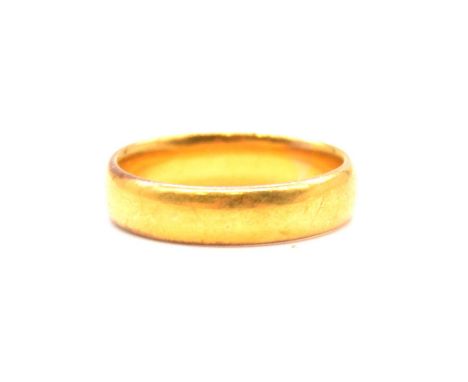 A 22 carat yellow gold wedding band, 5mm wide plain polished half D shape ring size P, Birmingham 1929, 7.2g.