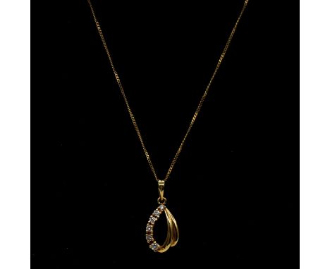 A diamond pendant and chain, six brilliant cut diamonds, graduating in size, claw set in an 18 carat yellow gold 10mm pear sh