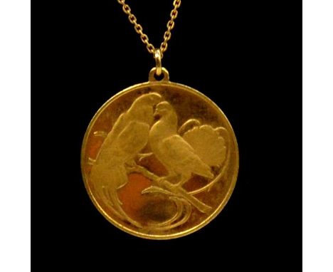 An 18 carat yellow gold love medallion / pendant, import marks for John Pinches, London 1975, engraved turtledoves to front, 