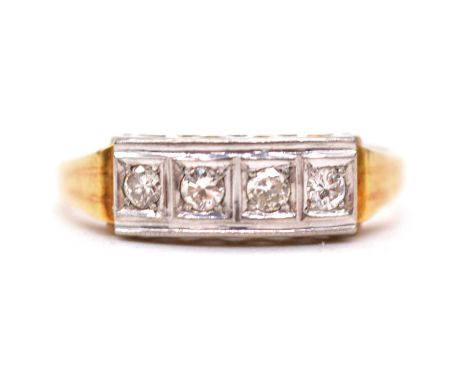 A four stone diamond ring, the four round brilliant cut diamonds pip and illusion set in an unmarked yellow and white metal m