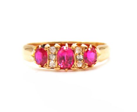 A synthetic ruby and diamond half hoop ring, the three synthetic rubies claw set and spaced by two pairs of three small diamo