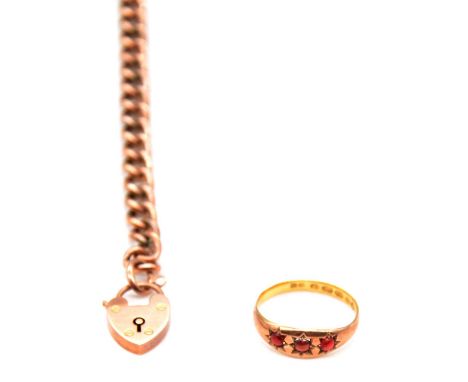 A 6.5mm gauge hollow curb link bracelet 18.5cm long with a 9 carat rose gold padlock fastener, 7g; a yellow metal tapered ban