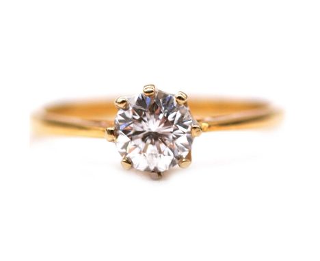 A diamond solitaire ring, the brilliant cut stone claw set in an 18 carat yellow and white gold mount ring size R, valuation 