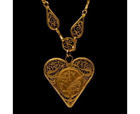 A Gold Half Sovereign Coin, George V 1914, set in a yellow metal 35mm filigree heart shape pendant on a 55cm fancy chain neck