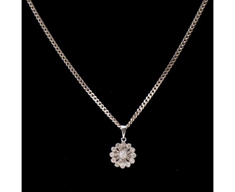 A diamond pendant on a silver chain, thirteen brilliant cut diamonds and twelve baguette cut diamonds set in a 9 carat white 